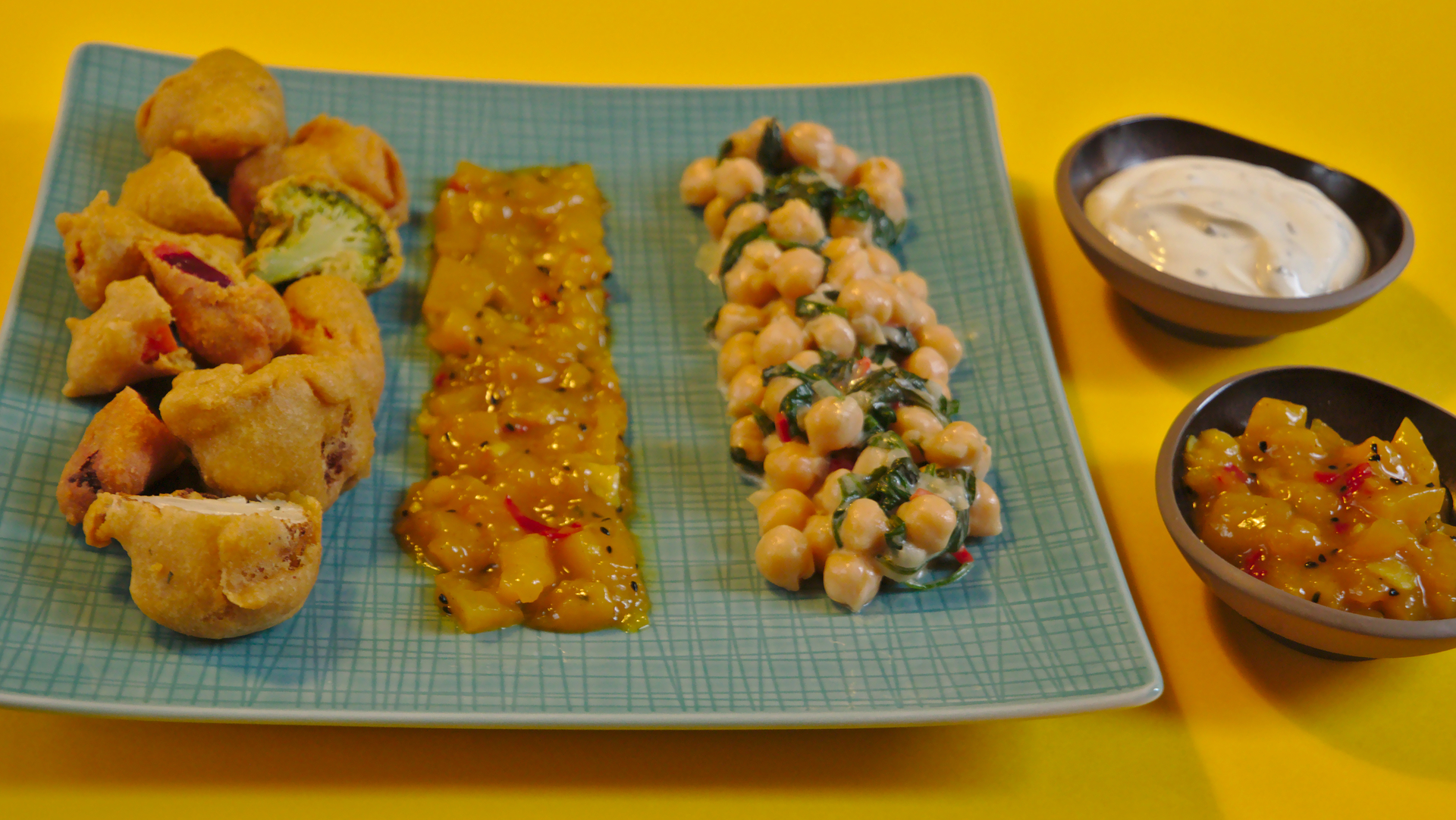 Served pakoras with chutney and coco chickpeas with spinach